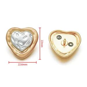 Detailed view of heart-shaped gold and silver metal buttons with dimensions 22.6mm