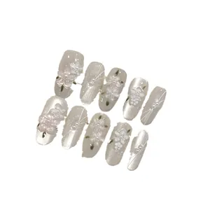 Handmade 3D floral cat eye press-on nails with white pearls and artistic details