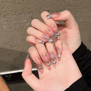 Long trapezoid press-on nails with blue cat-eye gradient and 3D crystal accents