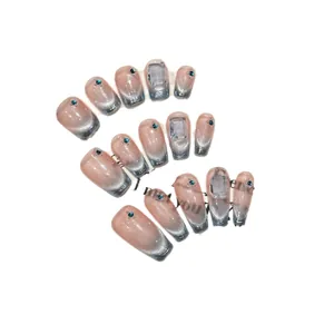 Blue cat-eye gradient press-on nails with luxury crystal gems and blue rhinestones