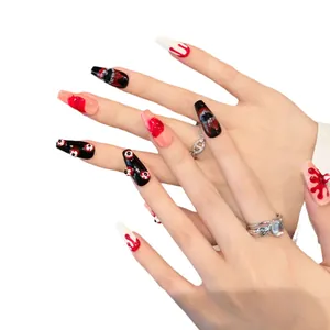 Handmade gothic press-on nails featuring 3D eyeball decor and bloody drips design