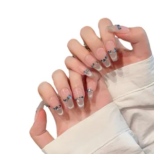 Französische Cat-Eye-Nägel zum Aufkleben mit blauen Kristallen und Trapezform