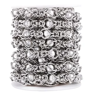 Macro detail of handmade stainless steel pearl chain on a spool for DIY jewelry making