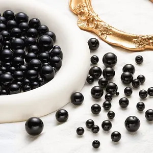 Polished black ABS faux pearls with holes in various sizes for DIY jewelry making