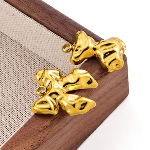 Macro shot of 18k gold plated irregular organic pendant with polished mirror finish