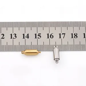 Macro view of magnetic cylinder clasps for jewelry making in gold and steel finish
