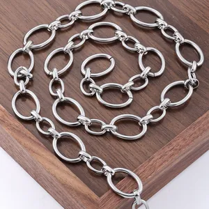 Polished silver stainless steel oval link chain displayed on a dark wooden tray