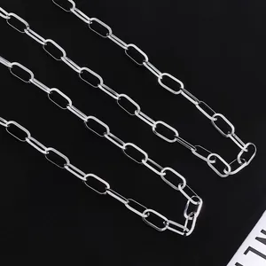 Macro view of polished silver oval link paperclip chain for DIY necklace making