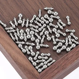 Macro shot of silver stainless steel spike and ball barbell jewelry for DIY punk accessories