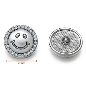 Detailed view of a 21mm silver smiley face metal button with sparkling rhinestones