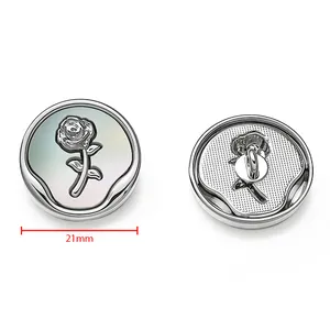 Detailed view of 21mm silver flower pearl button showing front rose design and back shank