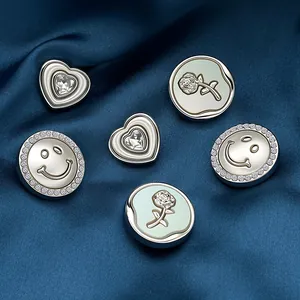 Silver metal buttons set featuring crystal heart, pavé smiley face, and rose floral motifs