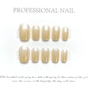 Champagne gold gradient pearl press-on nails with short square shape on display
