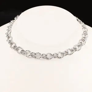 Polished silver stainless steel curb chain necklace with floral engraved texture