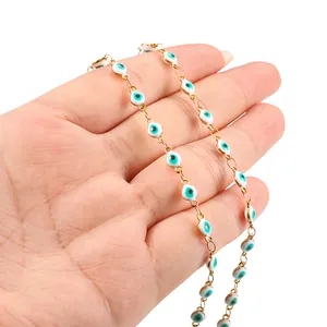 Gold-plated evil eye chain featuring white and turquoise enamel charms for DIY jewelry