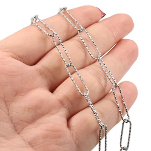Polished silver textured paperclip link chain with elongated oval rings and diamond pattern
