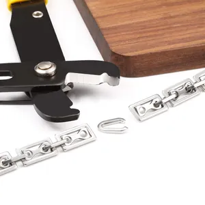 Manual chain cutter tool cutting through gold stainless steel rectangular link chain