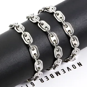 Polished silver stainless steel pig nose chain necklace on a black leather stand