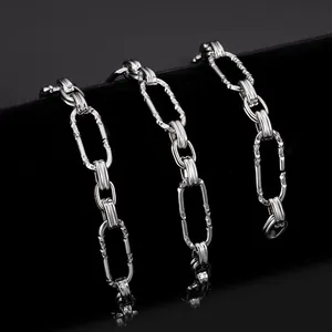 Macro view of silver diamond-cut oval link stainless steel chain for jewelry making