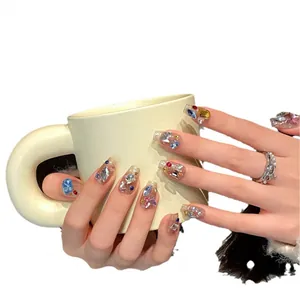 Luxurious handmade press-on nails with colorful rhinestones and sparkling gem details