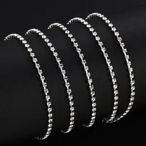 Sparkling stainless steel claw chain necklace with clear rhinestones on black display