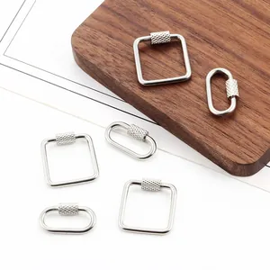 Macro detail of oval and square stainless steel screw clasp connectors for DIY jewelry