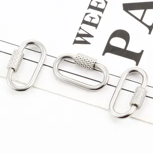 Three pieces of silver stainless steel screw ring connectors with knurled lock detail