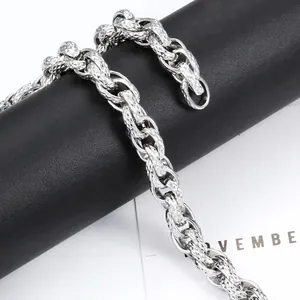 Polished silver stainless steel twist chain necklace with diamond-cut texture and industrial style
