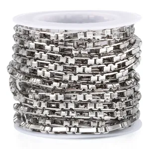 Polished silver stainless steel 3:1 box chain on a white spool for DIY jewelry making
