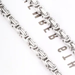 Close-up of silver Byzantine chain link texture in polished stainless steel for DIY jewelry