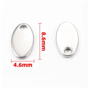 Polished stainless steel oval charms with 8.6mm by 4.6mm size markings on white background
