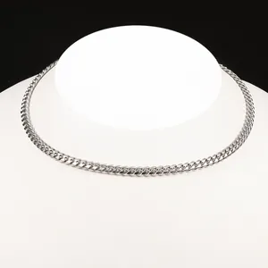 Polished silver stainless steel Cuban link chain necklace on mannequin torso