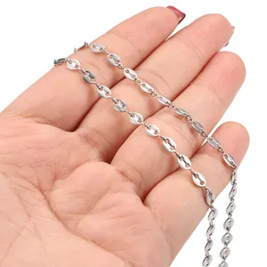 Polished stainless steel pig nose chain held in hand to show size and metallic texture
