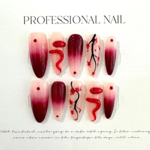 Detail of red snake 3D almond press-on nails with wine red gradient and floral art
