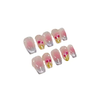 Pink gradient press-on nails with silver cat-eye finish and hand-painted tulip patterns