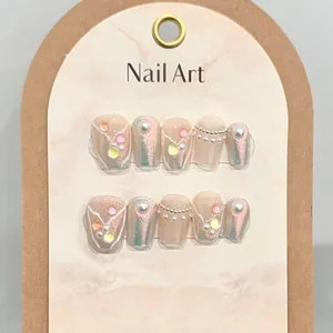 Handmade fishtail style press-on nails with 3D drop glue pearls and rhinestones