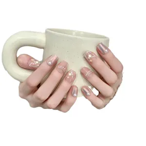 Handmade press-on nails with soft pink gradient, pearls and 3D fishtail details