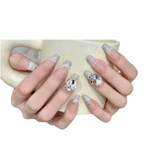 Handmade ballerina press-on nails with lavender French tips and crystal diamond accents