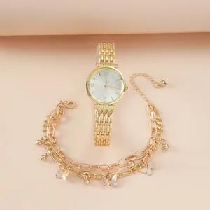 Coffret montre dorée élégante pour femme avec bracelet maille et motif papillon