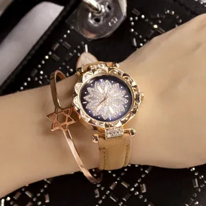 Roségouden dameshorloge met bloemvormige ring en bijpassende ster-armband