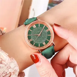 Green leather strap watch with rose gold case and crystal studded dial for women