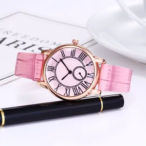 Detailed side view of pink leather strap watch with rose gold case and Roman dial