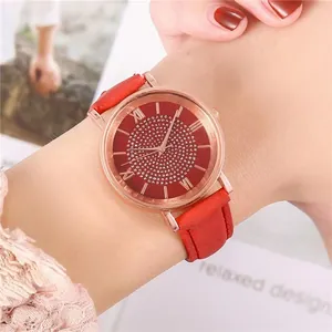 Detail of a ladies' quartz watch with red dial, rhinestones and Roman numerals