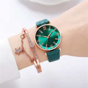Close-up of women's quartz watch with green sunray dial and rose gold star charm bracelet