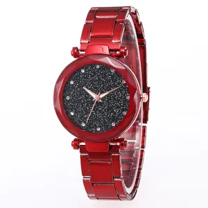 Detailed close-up of a red starry sky quartz watch featuring rhinestone time markers