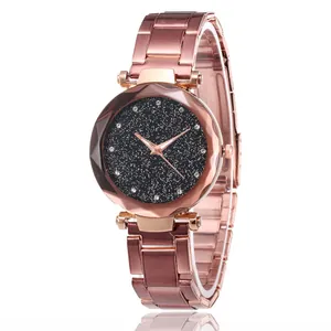 Detailed macro view of starry sky watch dial with diamond markers and rose gold case