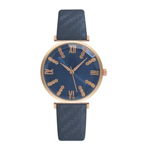 Women's blue quartz watch with multifaceted glass dial, rose gold case and textured leather strap