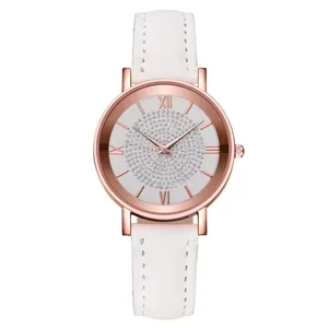 Close-up of women's watch with white leather strap and crystal rose gold roman dial
