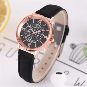 Women's rose gold quartz watch with starry rhinestone dial and black leather strap