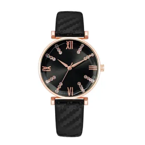 Detail of rose gold watch case with sunburst dial and rhinestone hour markers